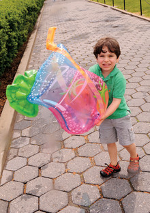 Reunion is fun for all, from alumni to their spouses/guests to their children. Here, a little Columbian plays with a balloon at the 2008 barbecue. PHOTOS: EILEEN BARROSO